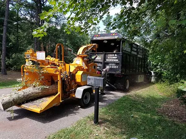 Big Timber chipper and chip truck on a job